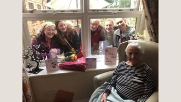 A birthday window visit for Lyndon Hall care home Resident
